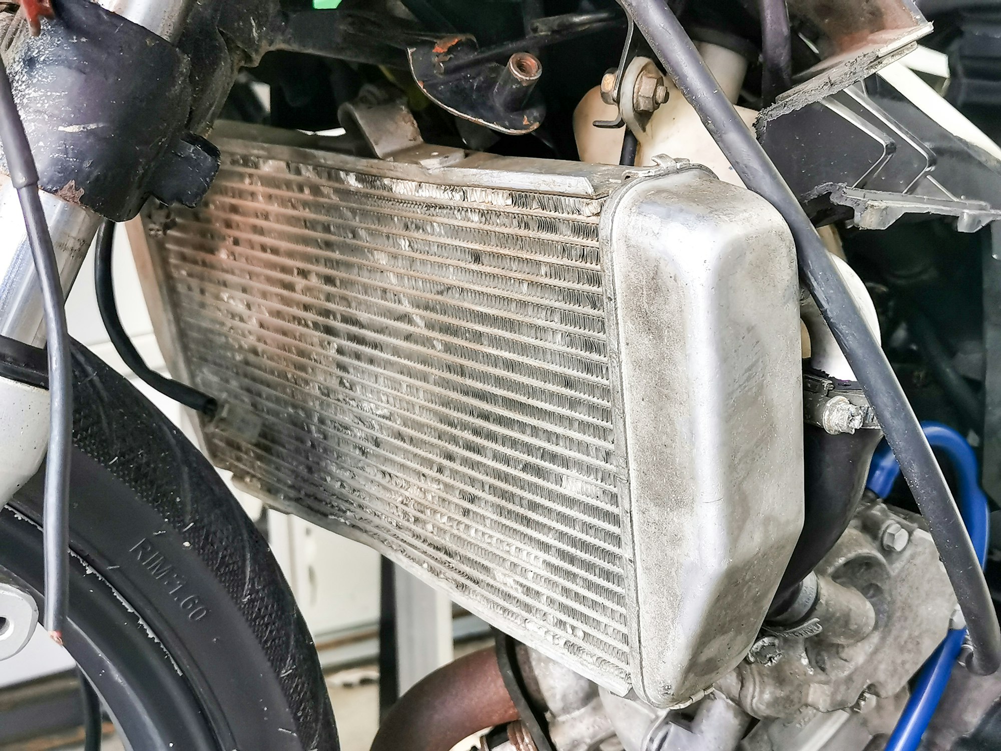 Selective focus close up image of motorcycle cooling radiator.